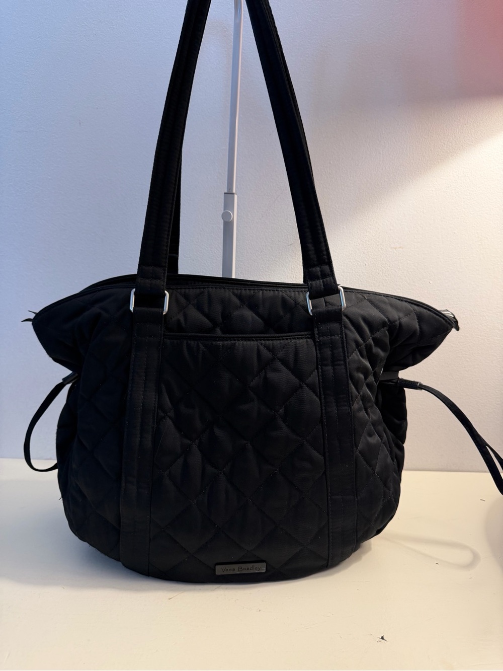 Vera Bradley black performance twill cinch oshoulder bag.